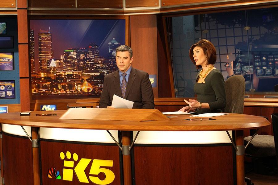 Anchors Greg Copeland and Amanda Grace sit at the King 5 news desk during the 4 p.m. news. 