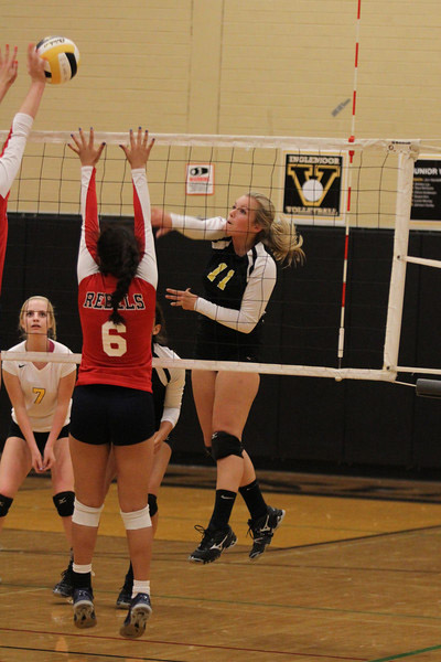 Senior captain Hailey Hagstrom makes an aggressive play at the net during match at home against Juanita.