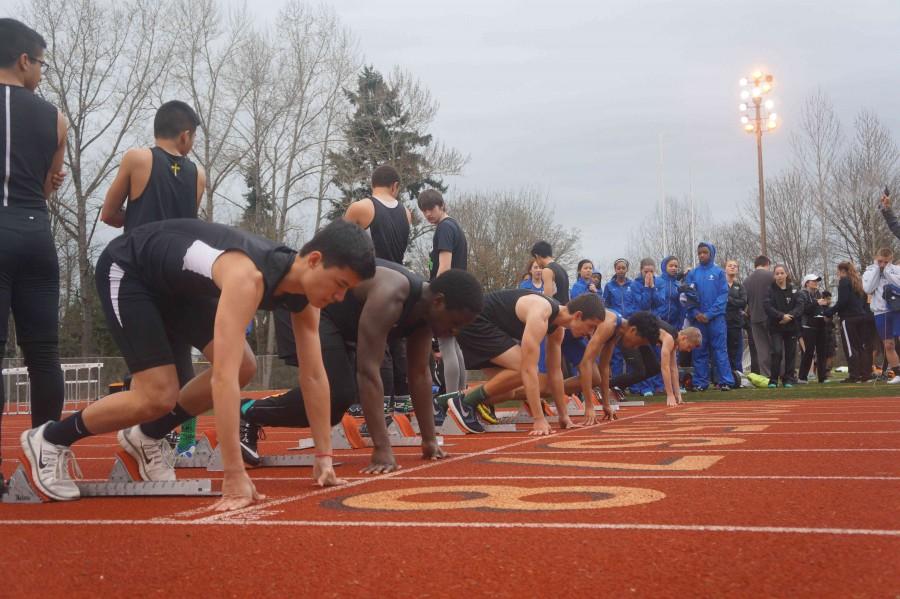 Junior Robin Takami prepares to take off from the blocks during the 100m event. He finished with a time of 12.68 seconds to place 15th at the jamboree on March 19. 