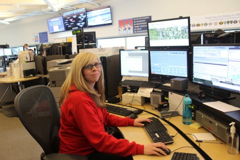 Kelly Stiefel sits at her desk, surrounded by computers and poised for action. Some of her job duties include answering 911 calls, dispatching units, running license plates, finding old records and listening to police radio.