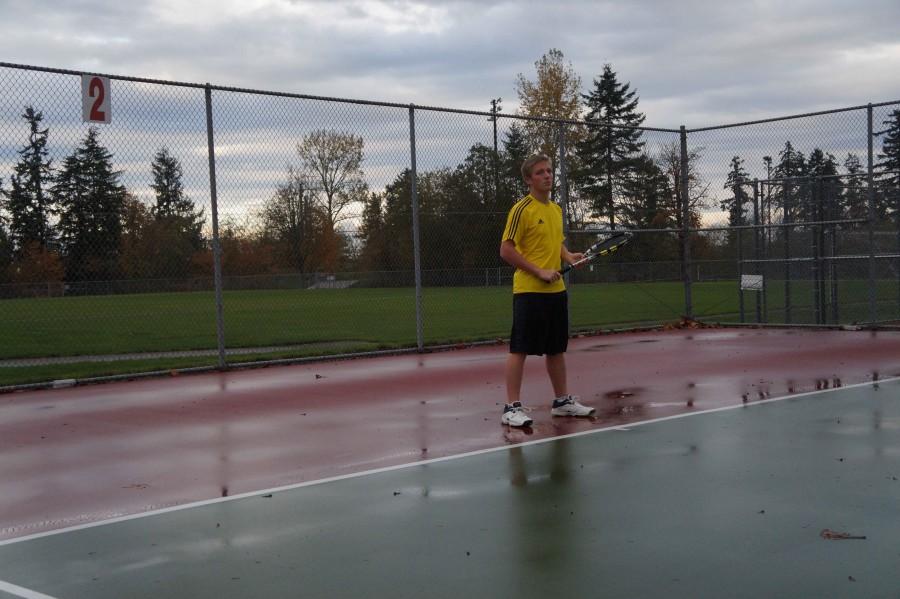Hansen takes a break from a long tennis practice. Hansen was the first singles player on boys’ tennis this year.