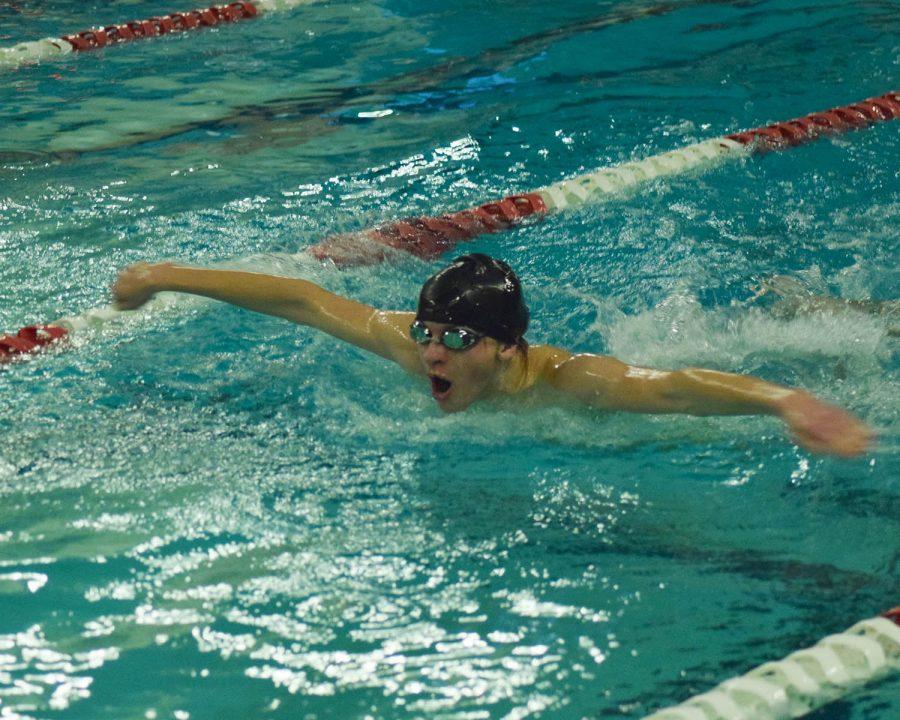 Sophomore Seth Edlund flies through the water in the 100 butterfly race at the Dec. 15 meet. His and the team’s effort combined resulted in a 97-64 win against Woodinville High School. 