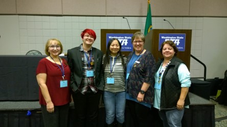 Junior Skyler Pfeil (second from the left) is all smiles alongside his mother and other contributors to Resolution #4 LGBTQ+ Inclusion. 
