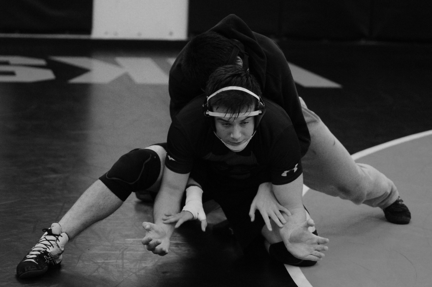 Junior+Braden+Dick+practices+with+his+teammate+from+the+defensive+position.+They+are+preparing+for+the+season+ahead%2C+with+their+first+home+meet+against+Newport+on+Jan.+4.+