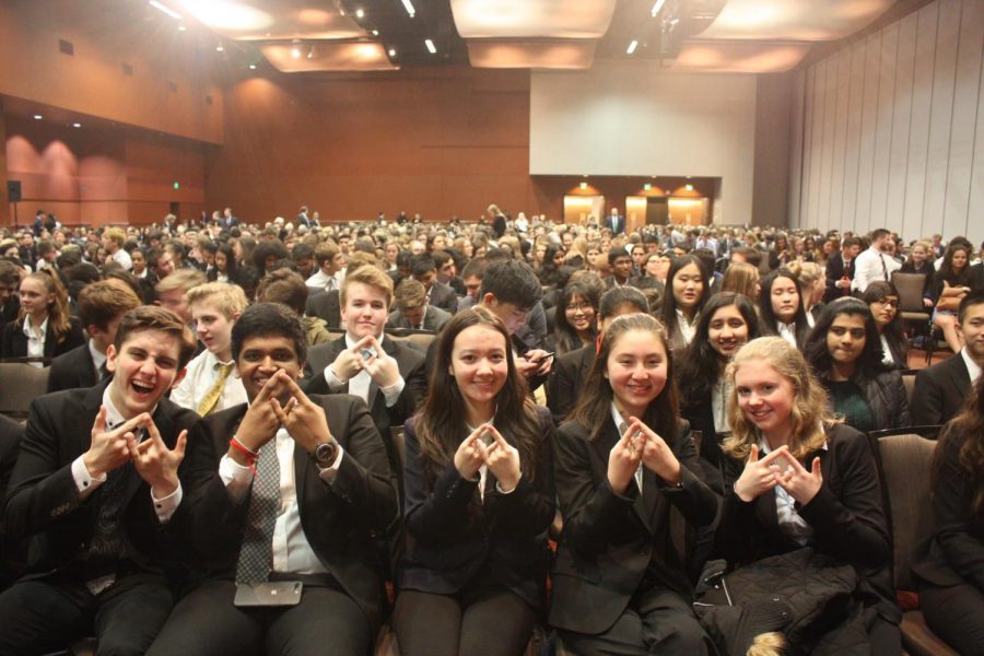DECA members display diamond figures, mimicking the international organization’s blue logo. From left to right: Andrew Jumanca, Tejas Raj, Angela Clemens, Kathryn Hill and Aleksandra Swietek. All five of these competitors qualified for the statewide competition, taking place March 1-3 in Bellevue.