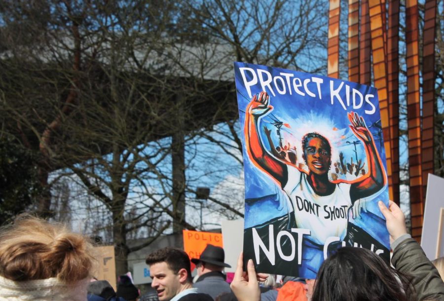 Many marchers carried a brightly colored sign depicting a black protester with his hands up, illustrated by artist Micah Bazant. While the march may have been organized in the wake of the Parkland school shooting, protesters often chanted about gun violence in general, including the police violence that disproportionately impacts minority populations.