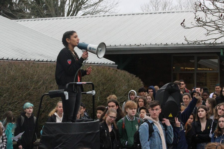Junior Anisha Chowdhry speaks out against gun violence at the student walkout on Wednesday, March 14. Schools throughout the U.S. participated in the walkout to support the survivors of the Parkland shooting and initiate legal change to gun laws. 