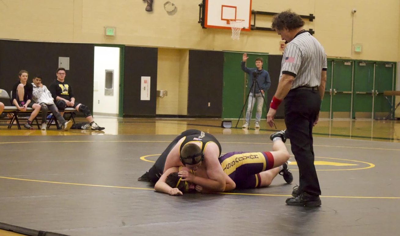 JV+wrestler+and+freshman+Xander+Alston+pins+his+opponent+at+a+meet+with+Issaquah+on+Dec.+6.+Alston+won+this+match%2C+but+ultimately+Inglemoor+lost+the+meet%2C+leaving+their+standing+at+0-2.