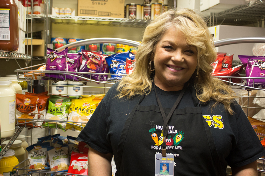 General+manager+Michele+Bergley+stands+in+front+of+the+new+chip+racks+in+the+back+of+the+cafeteria+room.+