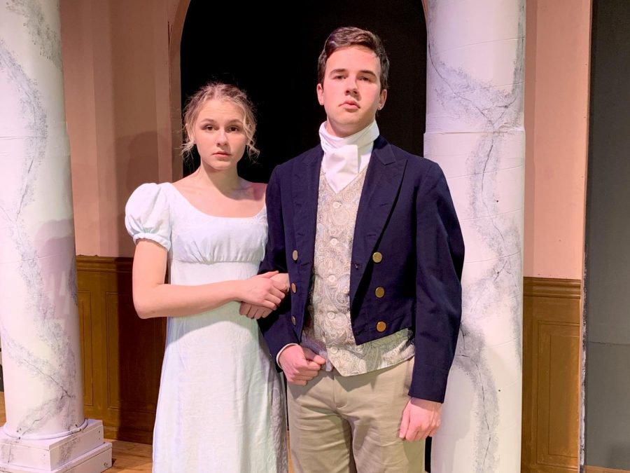 Sophomore Daisy Held and junior Sam Trott link arms in full costume as Elizabeth Bennet and Mr. William Darcy, respectively.