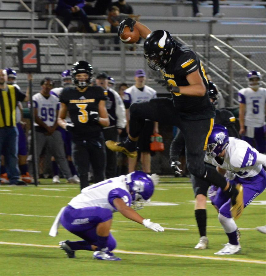 Quentin Moore jumps over another player at the 2018 homecoming game against North Creek. Moore described this moment as “his favorite highlight of the season.”