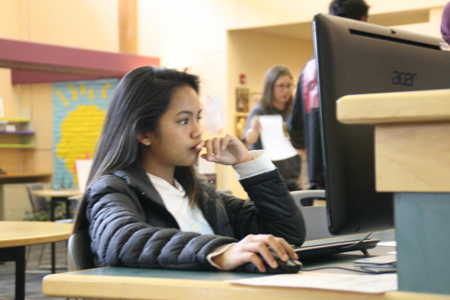 Freshman Sheiladay Arante works on a project on a computer in the library during her third period EL class. There are currently over one hundred students in the program with varying English-speaking abilities. 