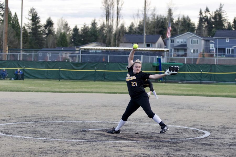 Pitcher Taylor Waara fires a pitch across the plate against the Woodinville Falcons. The girls lost a low scoring game, falling to the Falcons 2-1 on April 1st. 