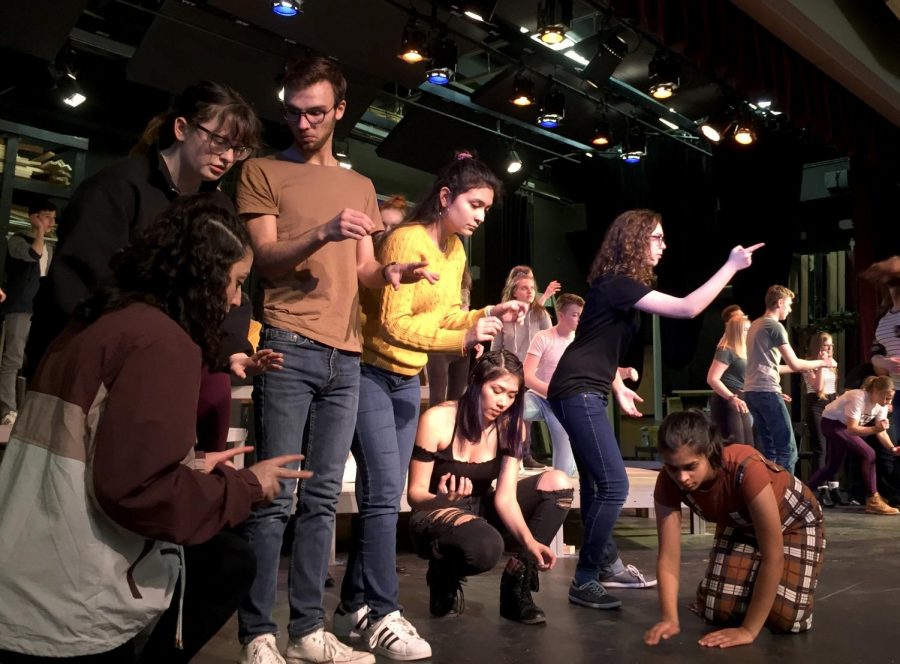 The cast of “Working” rehearse the song “All the Livelong Day,” acting as everyday citizens. While some cast members have a more specific role, during large ensemble pieces the whole cast works together as to create a choreographed scene. Pictured is Serrein Sabbah, Taylor Reddick, Hunter Essex, Malu Rivera, Briza De La Cruz, Julia Owens and Akhila Narayanan.