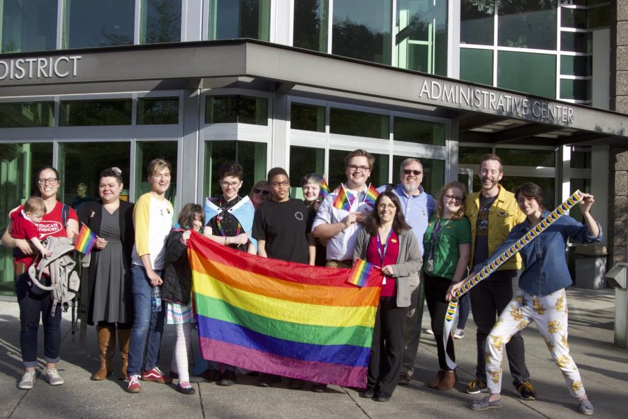Members+of+Northshore+Pride+%28NSP%29+pose+with+rainbow+flags+outside+of+the+Northshore+Administrative+Center%2C+following+the+School+Board+Meeting+on+Monday%2C+May+13.+The+group+was+joined+by+many+other+LGBT%2B+community+members+and+allies%2C+who+informed+the+School+Board+of+why+they+believe+representation+and+education+in+schools+is+important.
