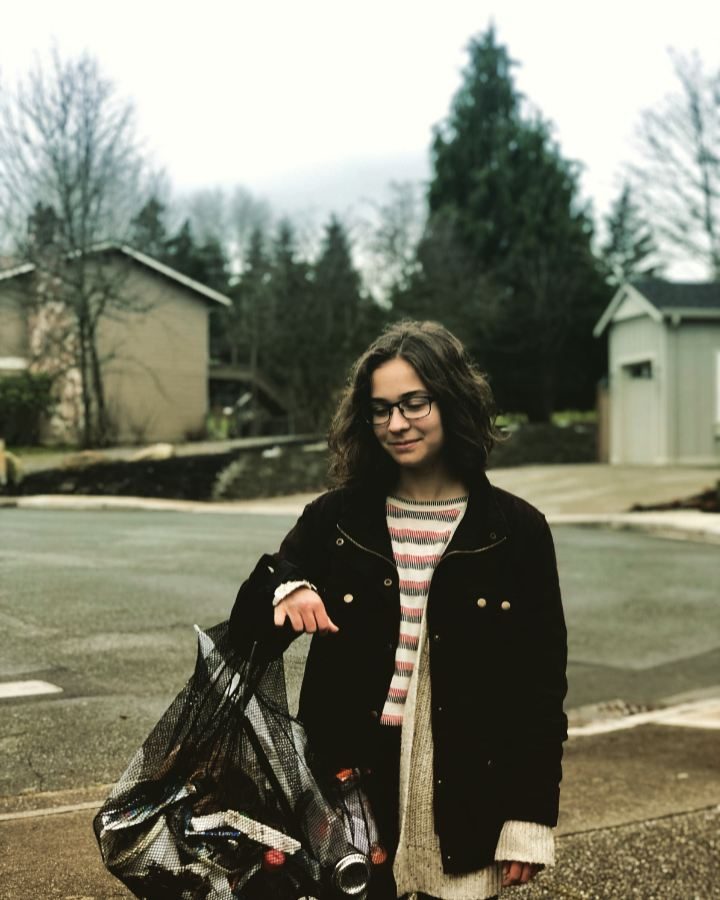 Quinn+Rector+holds+up+a+bag+of+trash+she+collected+outside+of+Bothell+High+School+during+one+of+her+many+trash+walks.