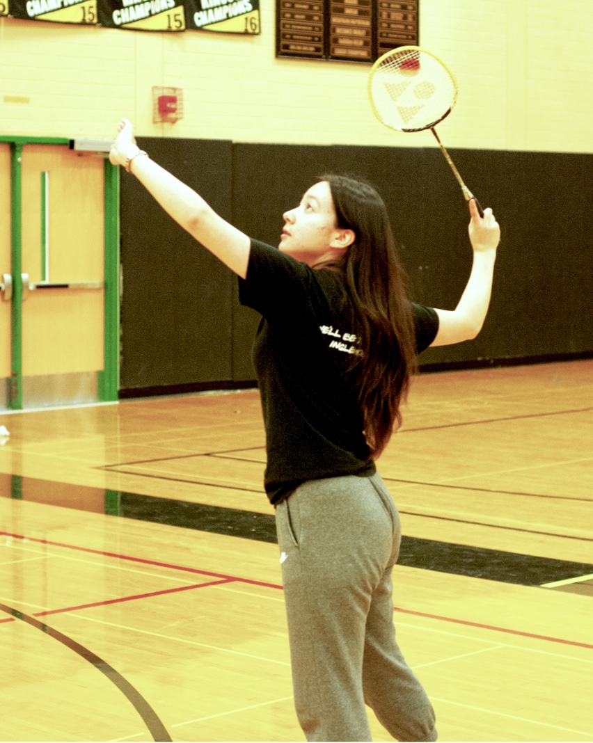 Senior+Angela+Clemens%2C+who+has+been+playing+badminton+since+her+sophomore+year%2C+hits+overhand+during+badminton+practice+on+April+30+for+their+KingCo+game+on+May+1.+