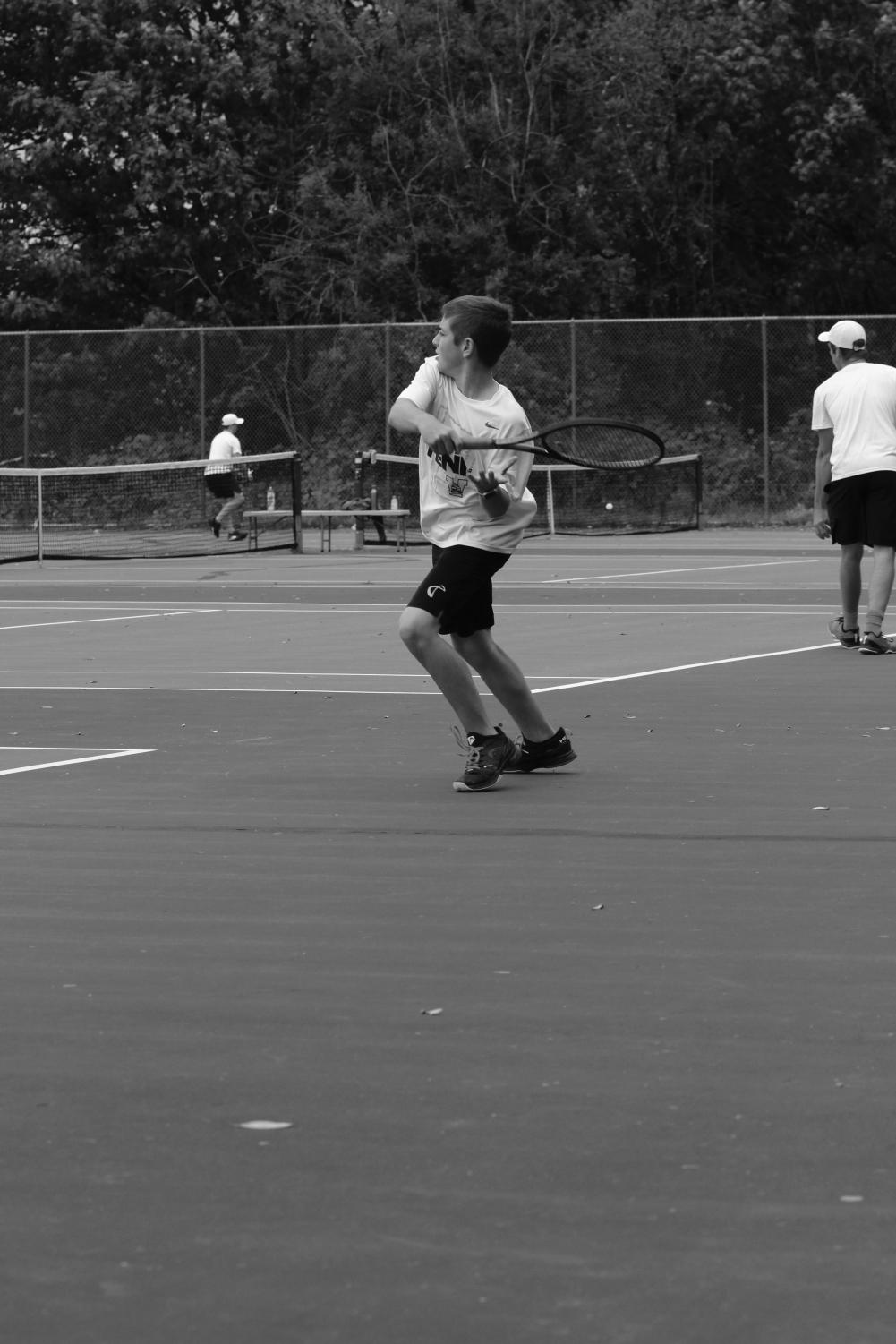 Adam+Walter+practices+his+swing+before+a+match+against+Issaquah+on+Oct.+3.+Photo+by+Priya+Annapureddy