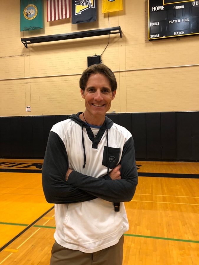 Dean Whellams of Breaking Down the Walls poses for a photo in the IHS school gymnasium. Photo by Mia Tavares