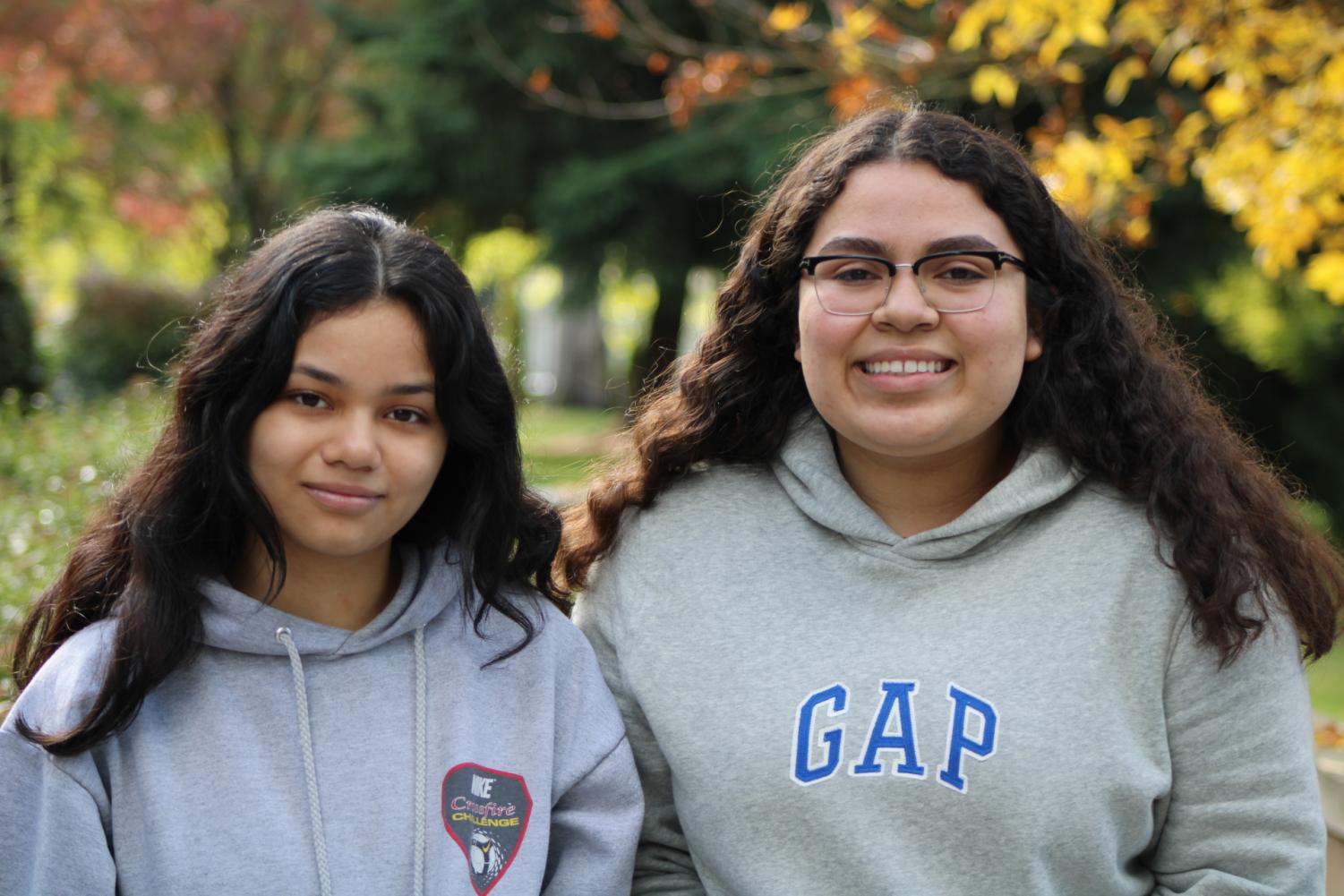 Sophomore+Jimena+Alarcon+%28left%29+and+senior+Vanessa+Morales+%28right%29+pose+for+a+picture+outside+of+Inglemoor.+