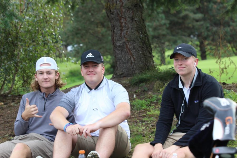 From left to right: Kyle Shea, Auggie Engwall and Braden Towle pose for a photo on the golf course. Photo by Selin Asan