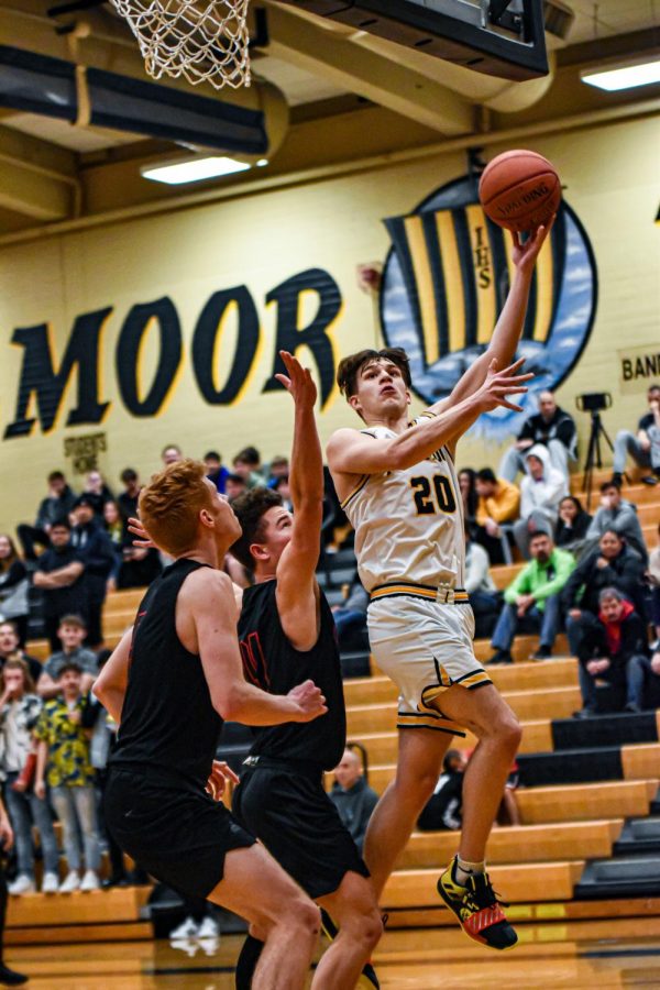 Senior Brady Casto shoots a basket in the Inglemoor gym

on many afternoons against other high schools. Photo cour-
tesy of Evan Morud