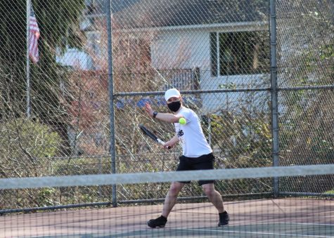  Senior and fourth singles player Daniel Orr winds up for a forehand during his match against Woodinville. Orr went on to win both sets, with scores of 6-2 and 6-0. Photo courtesy of Jim Orr. 
