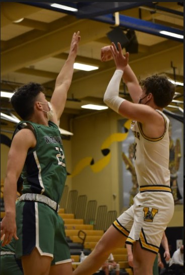 Senior Nick Smith shoots a fadeaway against Woodinville on Thursday, Apr. 20. Photo by Tam Tran. 