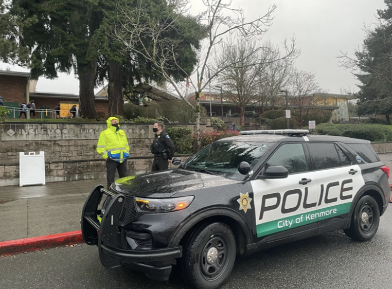 Northshore School District Director of Safety and Security Henry Simon and an officer of the Kenmore Police Department outside of Inglemoor High School on the morning of Dec. 2.  