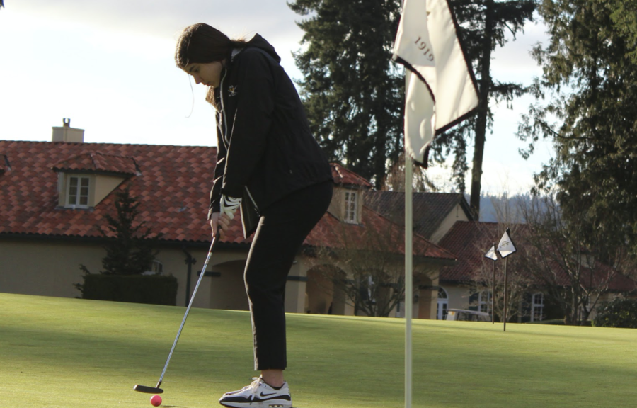 Junior Ava Lachmann practices putting on March 3.