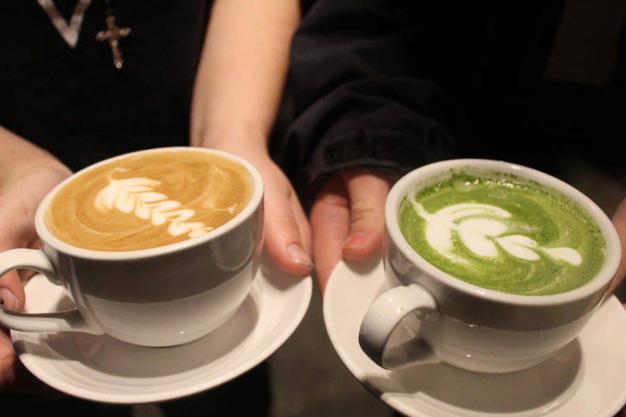 Nords show off the latte art on their matcha and café latte from Social Grounds Coffee Co. in Bothell on Nov. 7.