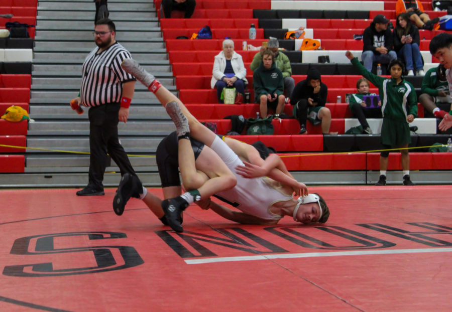 Colton Caley’s takedown during the tournament at Snohomish High School.