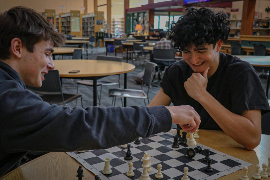 Chess club’s senior Vice president Liam Shalom captures senior President Roan Howard’s queen during an intense chess match in the library after school.