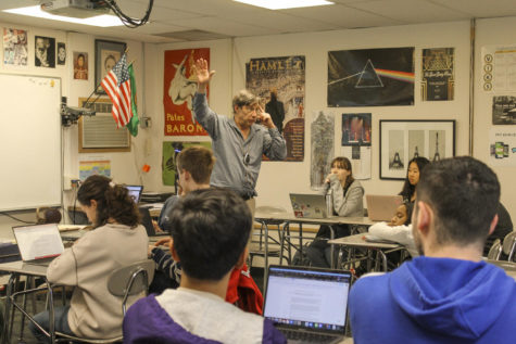 Burrus teaches a lesson about author Jorge Luis Borges to his seventh period class on May 25 