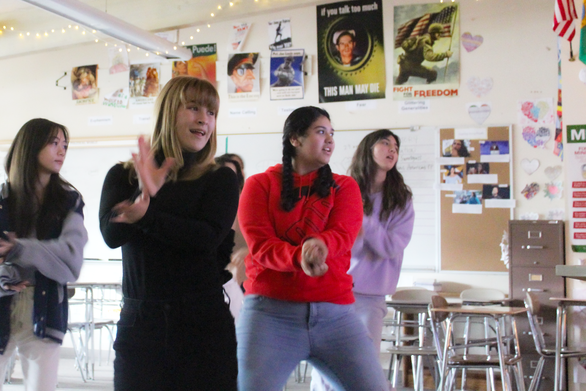 (From left to right) Sophomore Emma Chadwick, junior El Larson, sophomore Janelie Gallegos Campos and senior Ada Hogue midway through the choreography of “Nonstop” by OH MY GIRL. The club plans to perform this song, but does not have a performance date set.