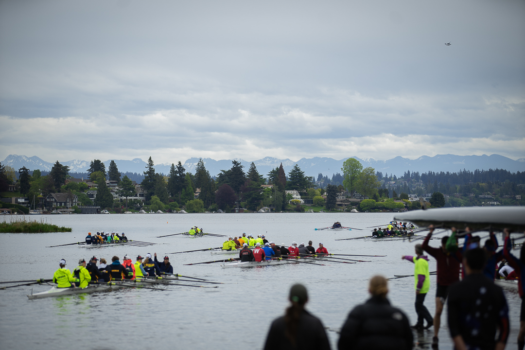 After crossing the finish line, crews gather in Portage Bay to watch the conclusion of other races. When all races ended, crews rowed together back through the Cut to Conibear Shellhouse. Over 80 teams competed at Windermere across 23 races.
