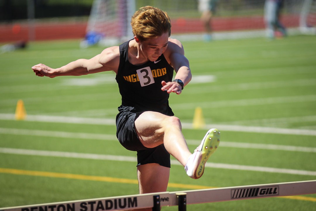 Caden Whitmere hops the second to last hurdle, only 75 meters away from the finish line.