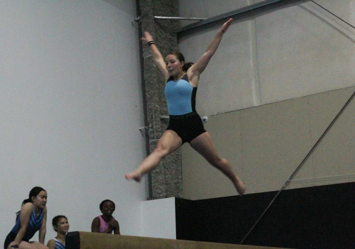 Lundberg practices her split jump on beam. “It’s not super difficult to do, but it’s kind of difficult to get good amplitude for the split,” Lundberg said. “I try to think about jumping really high.”