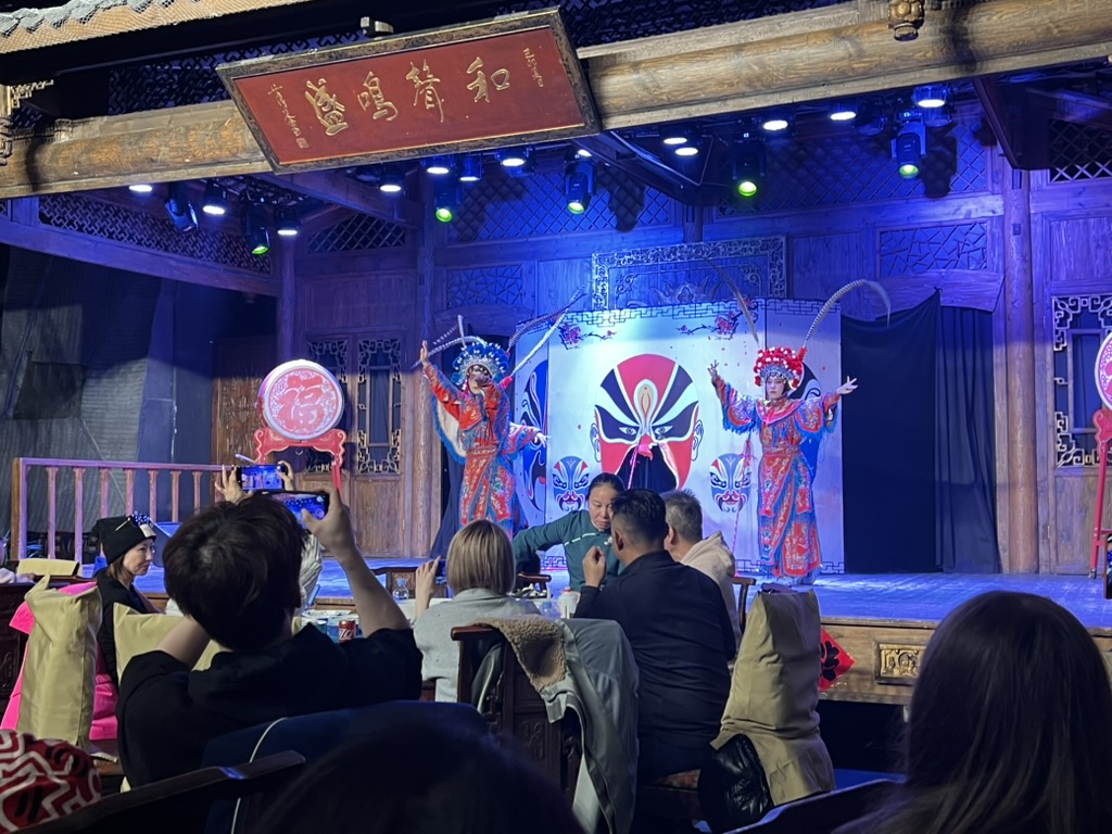 Students watch a performance in a restaurant in Chengdu. There were various dancing and face-changing performances. Photo courtesy of Wendy Barben. 