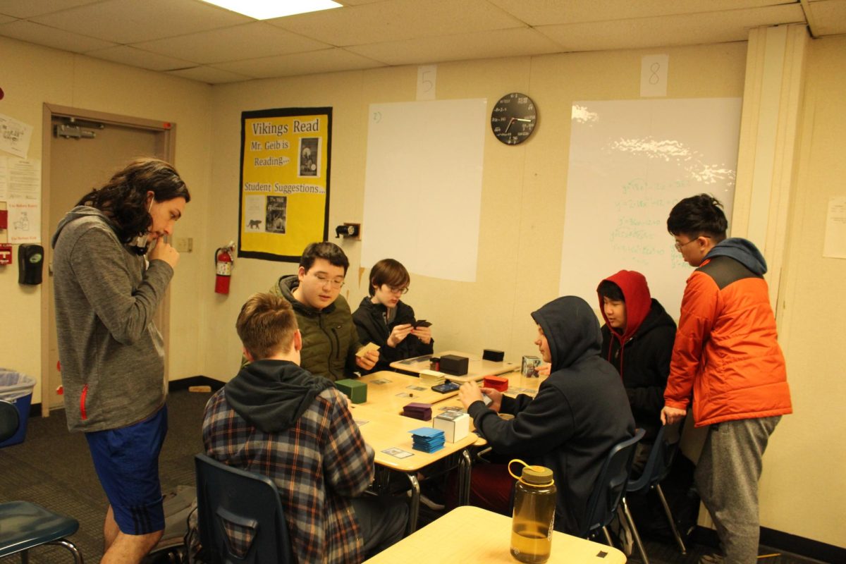 Chisholm supervises an ongoing game of Magic: The Gathering during one of the club’s Thursday
meetings. Most club members bring their own card decks to play.