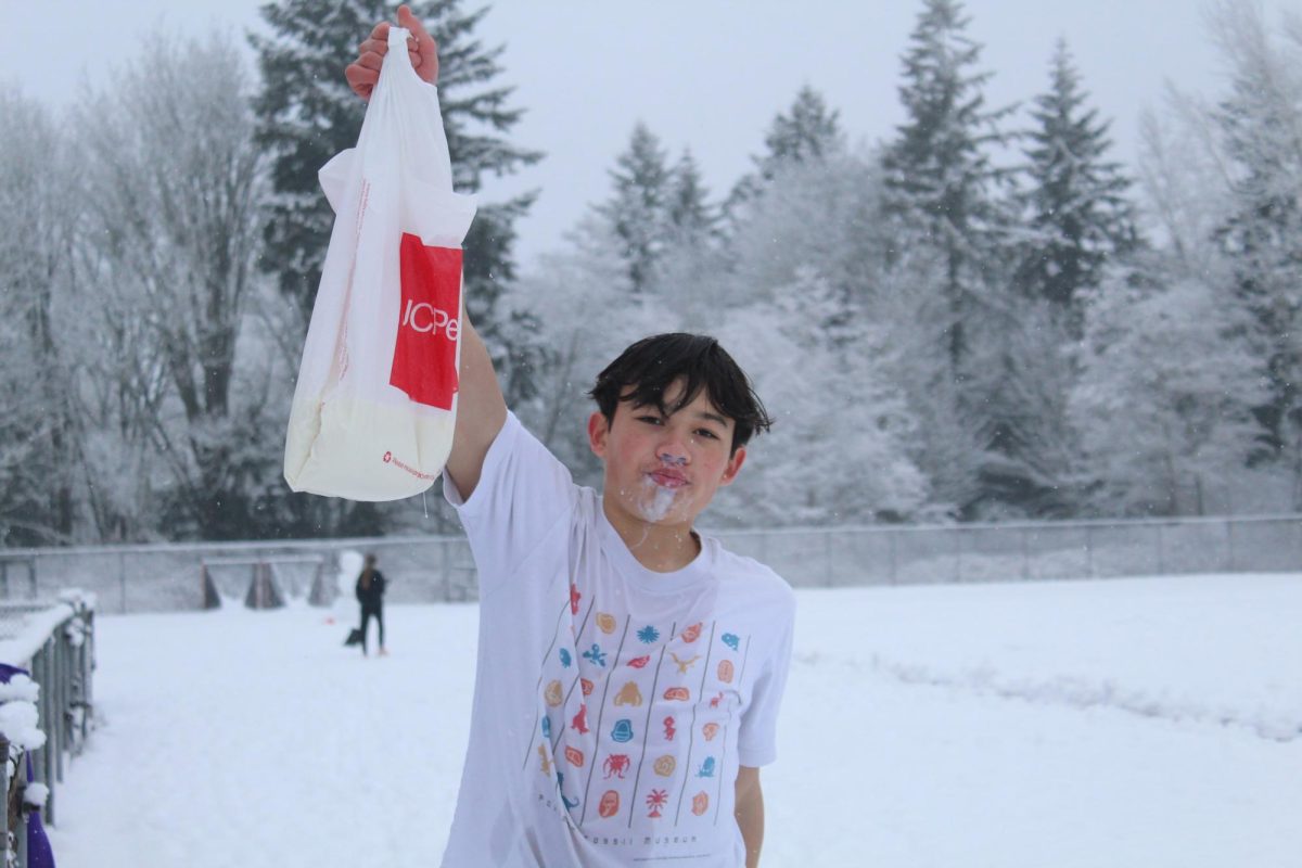 After consuming the entire gallon of milk and completing his mile run, Piper triumphantly holds up his puke bag, marking the end of his punishment.