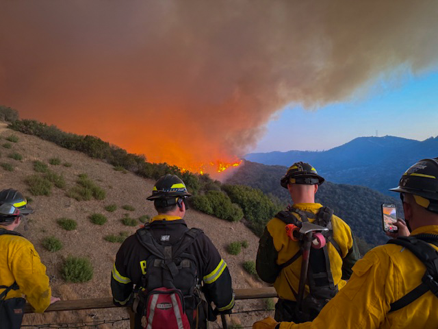 In the Pacific Palisades, California, firefighters watch the fire while posted in the Topanga Canyon above the Brentwood neighborhood Jan. 11. Photo courtesy of Jacob Yake.