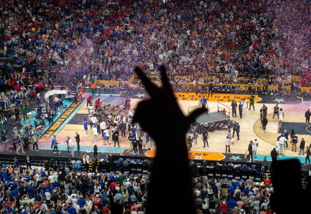 Florida fans go wild as they watch their team celebrate their national championship win.