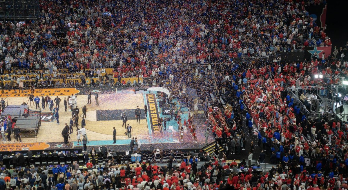 Confetti flies over the Houston student section, celebrating Florida's victory.