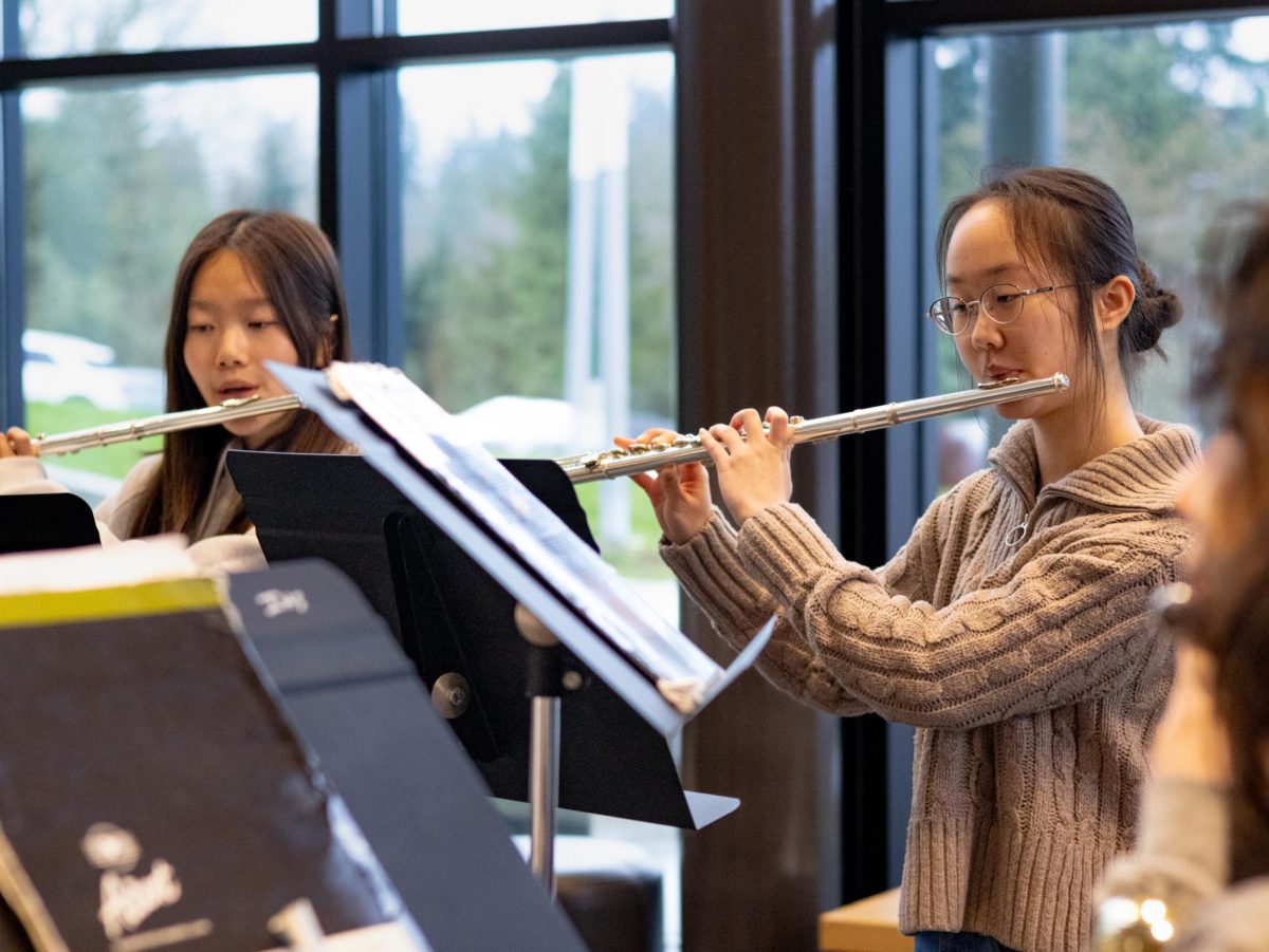Emily Peng and her flute ensemble practice their music for the state Solo and Ensemble competition. There are 5 total flutists in the ensemble.
