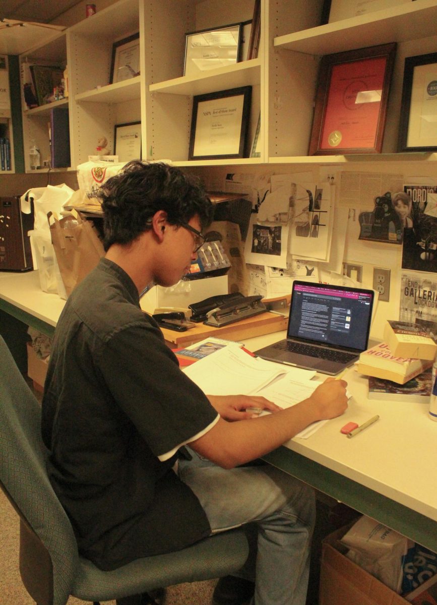 Nainggolan sits down to start studying for his IB history class.